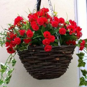 Large colourful artificial hanging basket with purple and red flowers ...