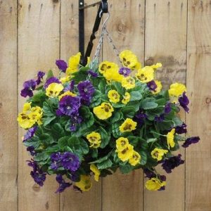 Artificial hanging basket with blue and yellow pansy flowers